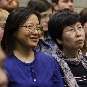Two women in the audience of the lecture by Dr. Roger Ames